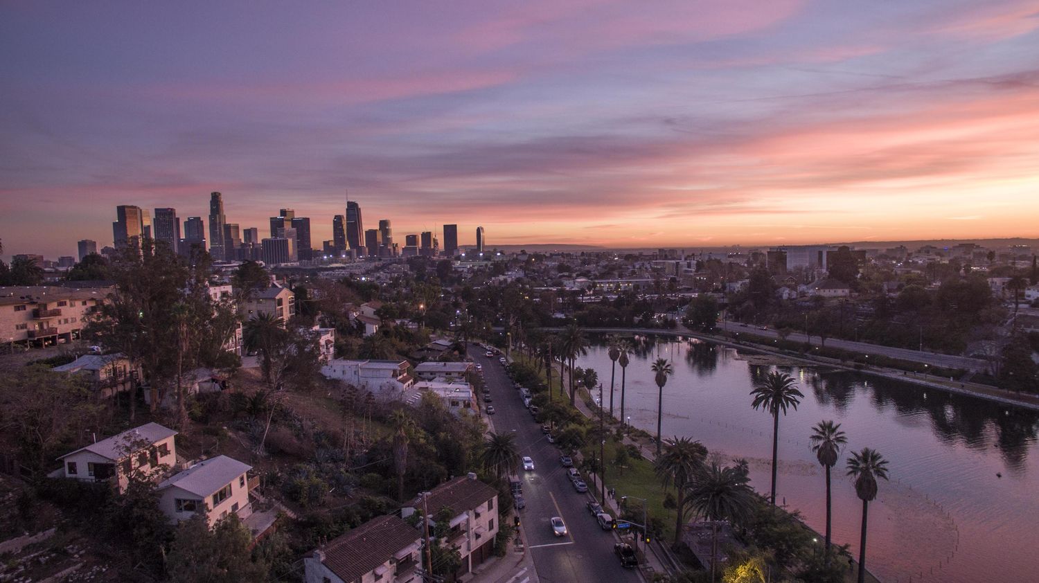 A city skyline at dusk, representative of commercial real estate let to businesses